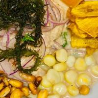 Ceviche De Pescado · Premium fresh raw fish cured in fresh lime juice, aji, chopped onions and cilantro with toas...