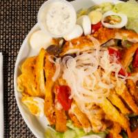 Buffalo Chicken Salad · Fried breast of chicken coated with buffalo sauce on a garden salad, with julienne carrots, ...