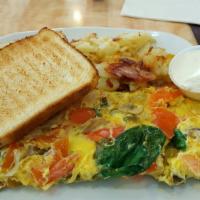 Egg White Veggie Omelette · Omelettes are made with three us grade a eggs and served with home fries and toast (white wh...