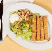 Taquitos · Chicken corn tortilla, rolled and fried served with pico de gallo and home dressing and parm...
