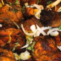 Tandoori Chicken · A half chicken marinated over night in yogurt, spices and fresh herbs then barbecued in clay...