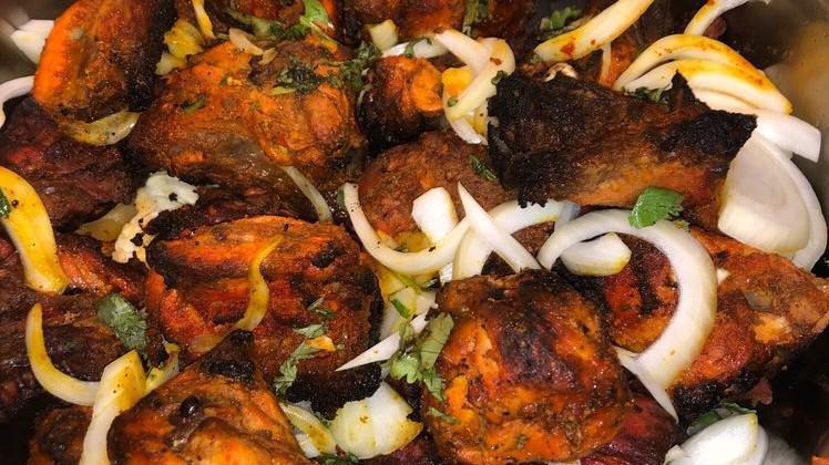 Tandoori Chicken · A half chicken marinated over night in yogurt, spices and fresh herbs then barbecued in clay oven (with bones). Served with basmati rice.