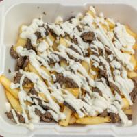 Beef Shawarma Fries · Fries topped with beef shawarma and garlic sauce.
