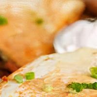 Chicken Quesadillas · One folded flour tortilla filled with marinated chicken & cheese