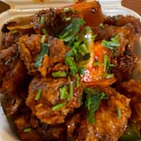 Gobi Manchurian · Vegan, gluten free. Chickpea flour battered cauliflower, fried, and then tossed in a spicy a...