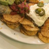 Double Decker Nachos · Soy free, gluten free. Corn tortilla chips smothered with re-fried black beans and Monterey ...