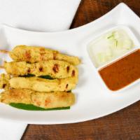Grilled Chicken Satay · On skewers, coconut milk-turmeric, peanut sauce and cucumber relish.