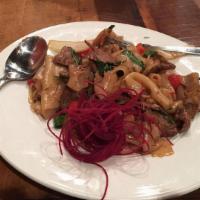 Drunken Noodles · Spicy. Flat rice noodles, tomato, sweet basil, onion, bell pepper, chili garlic puree.