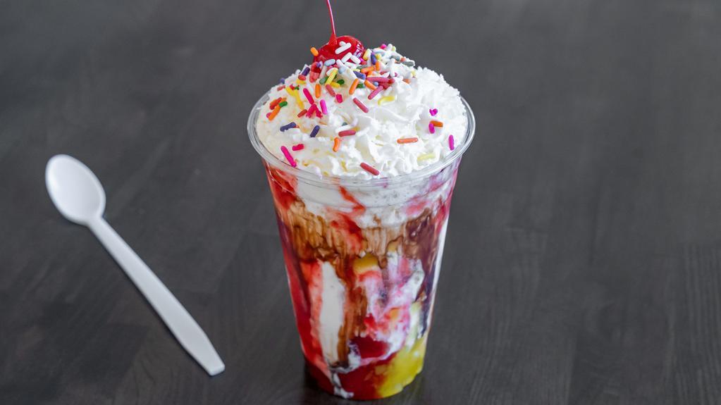 Banana Split Shake · Banana ice cream blended with strawberry, pineapple and chocolate syrup, topped with whipped cream, rainbow sprinkles and a cherry on top!