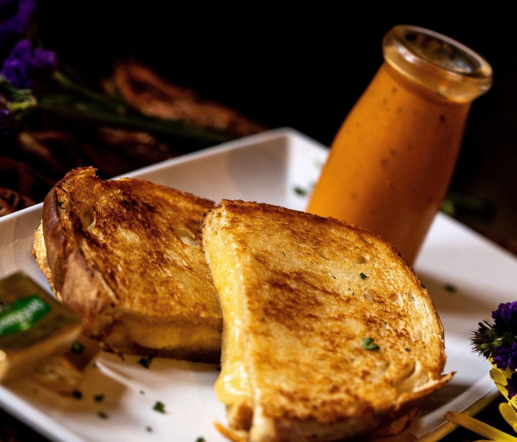 Grilled Cheese · Dubliner & Provolone Cheese on Sourdough Bread. Served with a side of French Fries