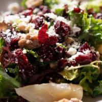 Poached Pear Salad · Greens, Caramelized Walnuts, Dried Cranberries, Poached Pears & Goat Cheese in Champagne Vin...