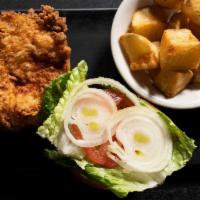 Fried Chicken Sandwich · Marinated in Buttermilk and Spices, served on a homemade Brioche Bun with Lettuce, Tomato, O...