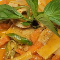 (10) Red Curry · Spicy. Spices blended in chili paste, bamboo shoot, basil, bell pepper, simmered in coconut ...