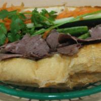 129 - Brisket Hoagie · Beef Brisket, butter, sauteed scallions, house sauce, pickled carrots, cucumber, jalapeno pe...