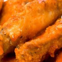 Chicken Wings · Six chicken wings in buffalo sauce with a side of ranch.