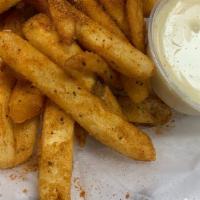 Old Bay Cheese Fries (American Cheese Sauce Side) · Our delicious French fries topped with old bay seasoning. Served with a side of American che...