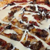 Cheesesteak Pizza · Steak, American cheese sauce, Mozzarella,  and red sauce.