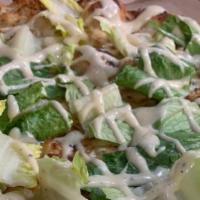 Chicken Caesar Pizza · Chicken, mozzarella, parmesan, lite sharp provolone, romaine lettuce and Caesar dressing. 
G...