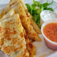 Al Pastor Quesadilla · Marinated pork with pineapple, onion, and rice. Quesadillas are prepared with melted cheese....