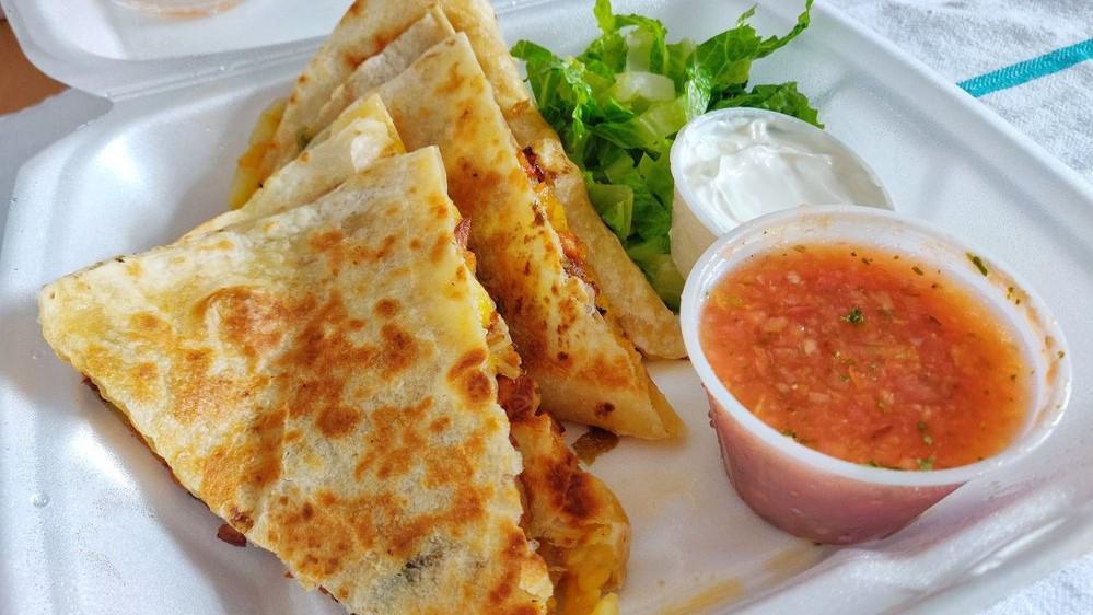 Al Pastor Quesadilla · Marinated pork with pineapple, onion, and rice. Quesadillas are prepared with melted cheese. Served side salsa and sour cream.