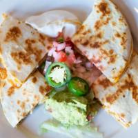 Quesadilla · Flour tortillas stuffed with cheese, jalapenos and scallions, served with lettuce, Pico de G...