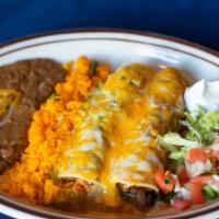 Chicken Enchiladas · Shredded chicken covered with our homemade green tomatillo sauce and melted cheese.