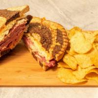 The “Smokin Hot” Reuben · A 1/2 pound of Hot Corned Beef with melted Swiss cheese, sauerkraut and Thousand Island dres...
