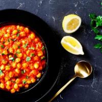 माखन वाला चना   Makhanwala Chana · Gluten-free. Chickpeas cooked in a rich buttery tomato sauce. Served with basmati rice. Nut-...
