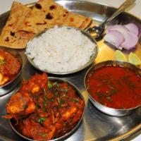  महाराजा थाली (मांस और चिकन)   Maharaja Thali (Meat & Chicken) · Choice of one  chicken entree and 1 meat entree. Served with basmati rice and 2 made-to-orde...
