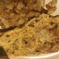 Veggie Omelet · Eggs omelet with Mushrooms, onions, tomato, green peppersserved with home fries and toast