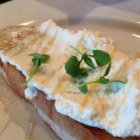 Ricotta Crostini · Toasted crostini topped with house made ricotta, thyme and honey.