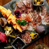 Citizen Charcuterie Board* · Cured meats, aged hard cheese, pickles & olives, fruit, grilled bread.