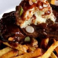 Classic Hanger Steak Frites* · Grilled hanger steak, house fries, truffle oil, red wine demi-glace, blue cheese butter, sca...