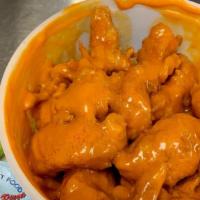 Monster Wing Dings · Battered and crispy fried 10 monster wing dings and side of BBQ or hot sauce. Add extra blue...