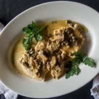 Piccata · Lemon butter sauce, fresh mushrooms and capers.