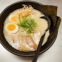 Classic Tonkotsu Ramen · Thick, rich, creamy, 15-hour pork broth, topped with chashu, seasoned egg, bean sprouts, sca...