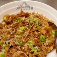 Beef Sukiyaki Don · Thin sliced ribeye and shredded onion cook in ground ginger, sake, soy, and Japanese sweet w...
