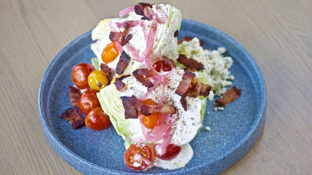 The Wedge Salad · Buttermilk dressing, blue cheese, blistered & fresh tomatoes, pepper bacon, pickled red onion.
