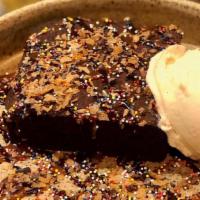 Warmed Brownie · brownie, vanilla ice cream, chocolate sauce, caramel, feuilletine, rainbow jimmies