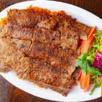 Meat Gyro (Doner) · Vertically grilled lamb/beef cut very thin slices and served with rice and greens.