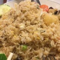 Pineapple Fried Rice · With chicken or beef or pork mixed with carrots, green onion, egg and white onion.