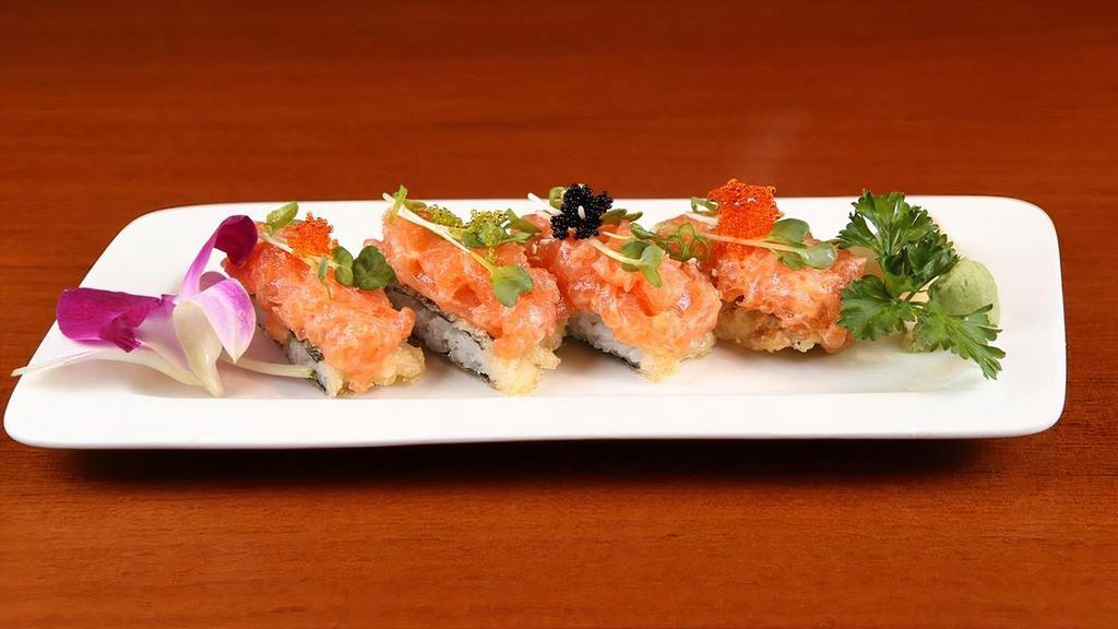 Spicy Salmon Tartar · Spicy salmon, green baby, tobiko, top on fried seaweed with rice