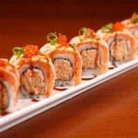 Salmon Torch Roll · Torched salmon, spicy crab, flying-fish roe, tempura flakes and spicy mayo. Served with eel ...