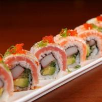 Triple Torch Roll · Torched tuna, salmon, yellowtail and flying-fish roe on top of california roll