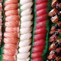 G: Sushi Platter (61Pcs) · 15 pcs Tuna Nigiri, 15 pcs Salmon Nigiri, . 15 pcs Yellowtail Nigiri, 8 pcs Eel Nigiri, . 8 ...