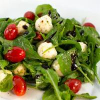 Caprese Salad · mixed greens, mozzarella pearls, grape tomato, pesto, white balsamic dressing, balsamic glaze