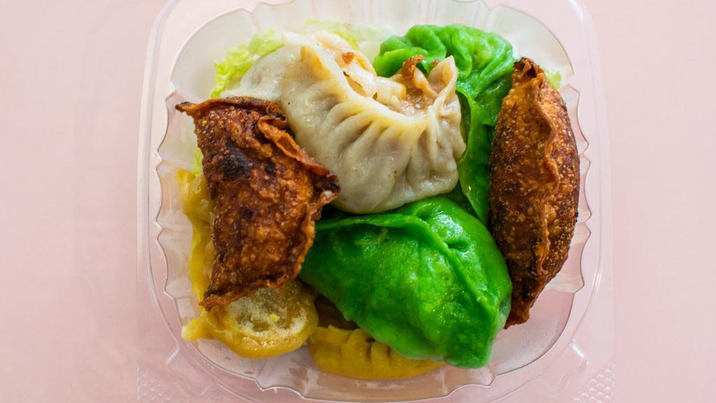 Dumpling Sampler (8) · 8 pieces of assorted dumplings comprised of pork  and napa, pork and leeks, chicken and vegetables