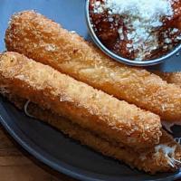 Mozzarella Sticks · Hand rolled and breaded mozzarella sticks fried to perfection and served with marinara