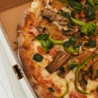 Veggie Delight Pizza · Mushrooms, onions, peppers, spinach, broccoli, tomatoes and eggplant.