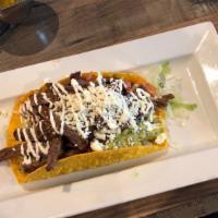 Taco Loco · Gluten free. Large crispy corn tortilla topped with beans, lettuce, pico de gallo, guacamole...